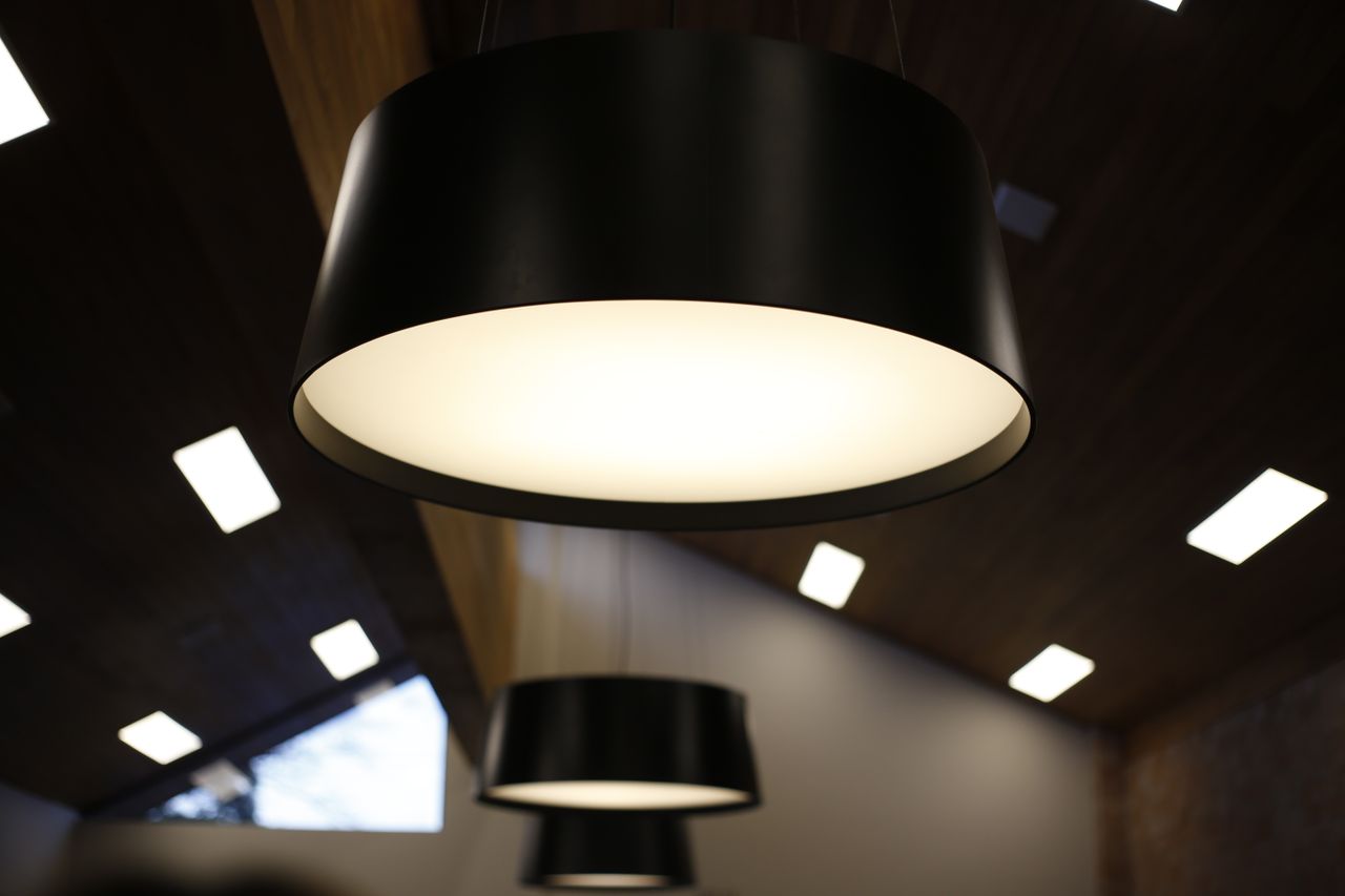 Close-up of modern ceiling lights in a stylish, contemporary interior space.